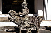 Bangkok Wat Arun - the gallery is lined all around with beautiful statues of chinese figures.